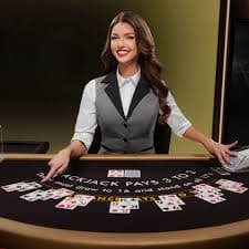 Blackjack live-dealer table with dealer and cards visible
